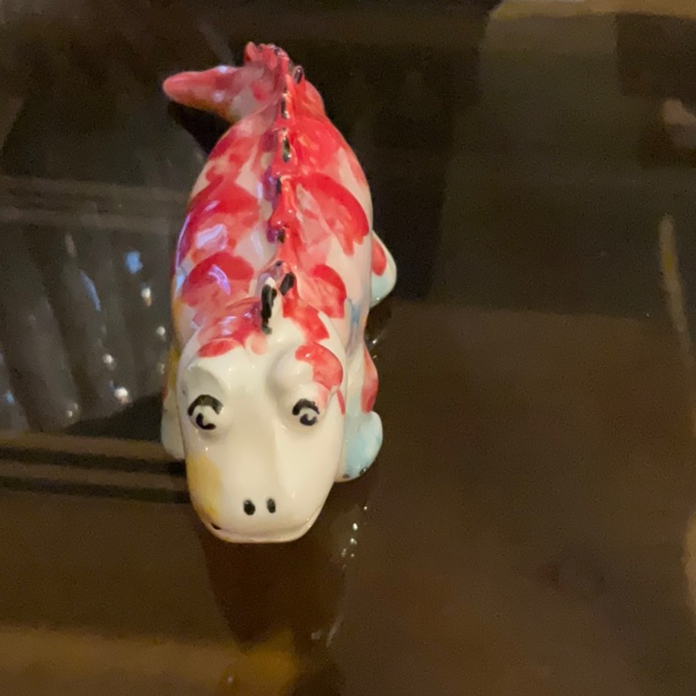 Adorable hand made and designed dinosaur.  Mississippi artist.  Great gift.